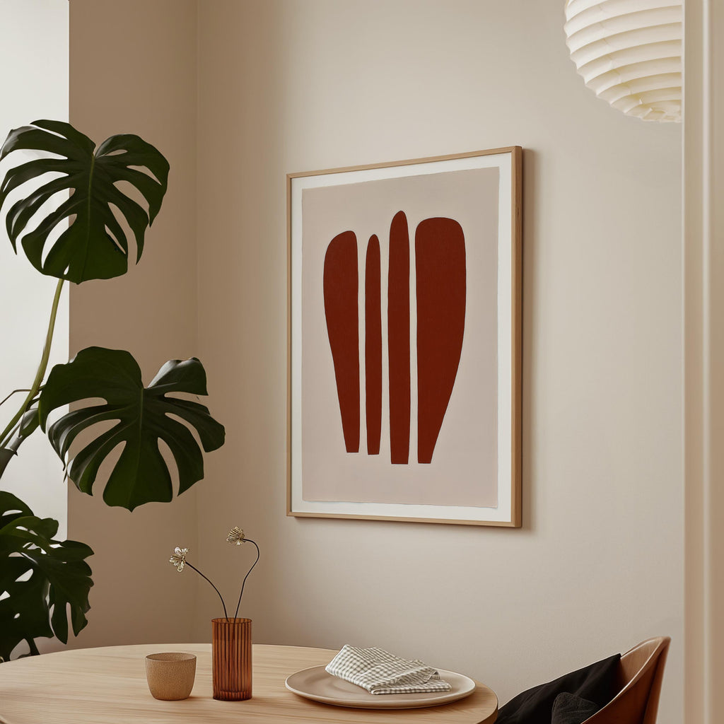 a minimalist dining area with a wooden table, a vase with flowers, and a framed abstract art piece on the wall.