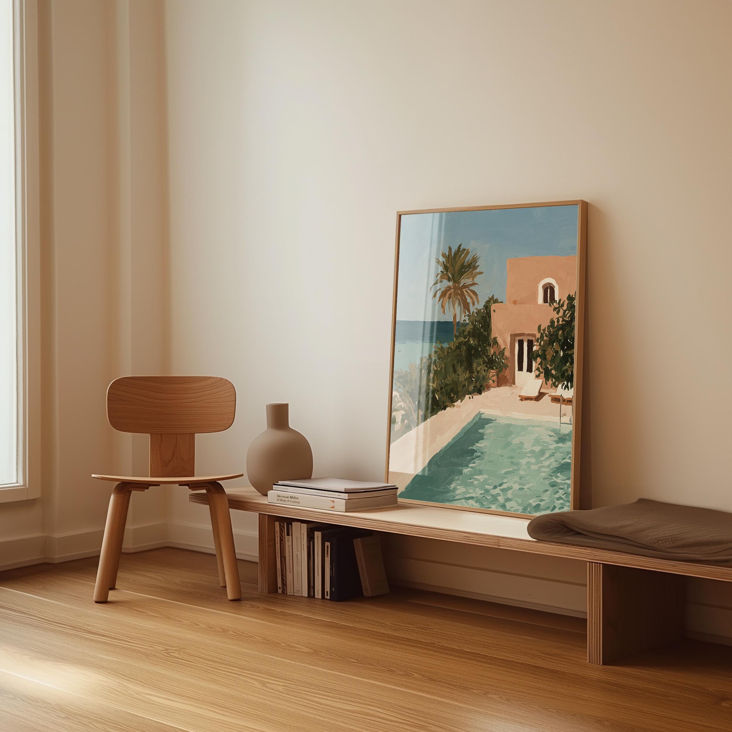 a wooden chair, a wooden bench, a vase, and a framed picture of a poolside scene with a building and palm trees.