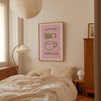 a bedroom with a bed, a lamp, and a framed poster on the wall.