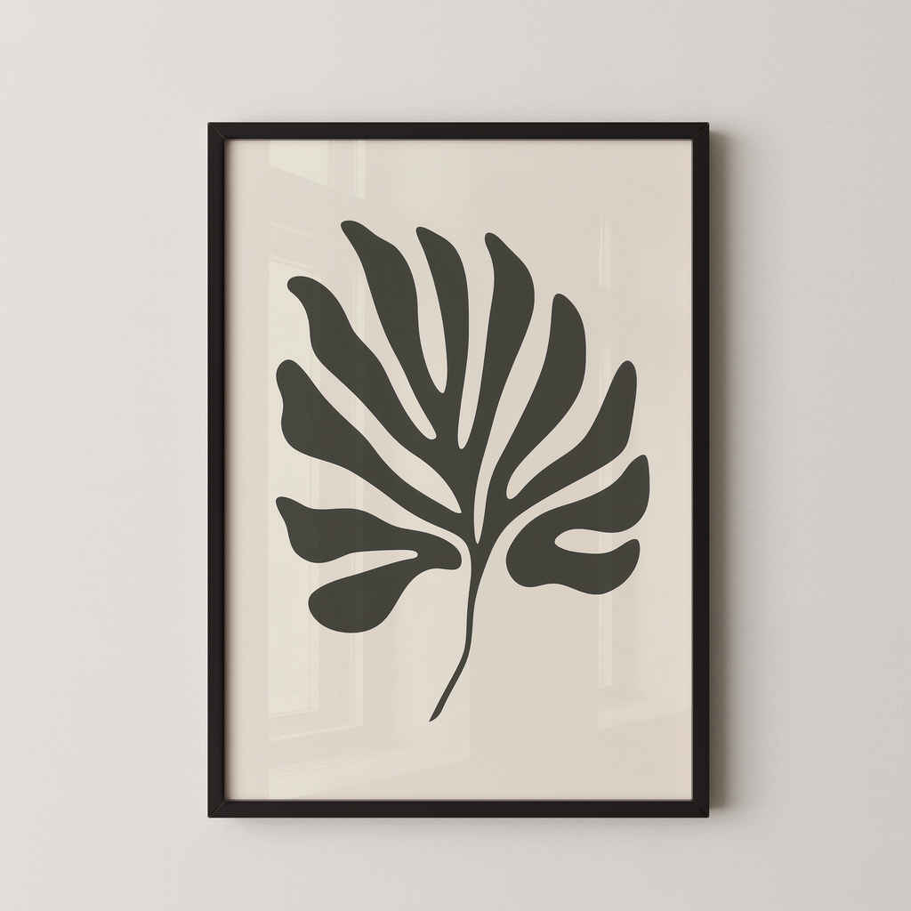 a framed black and white leaf with a unique, abstract design.
