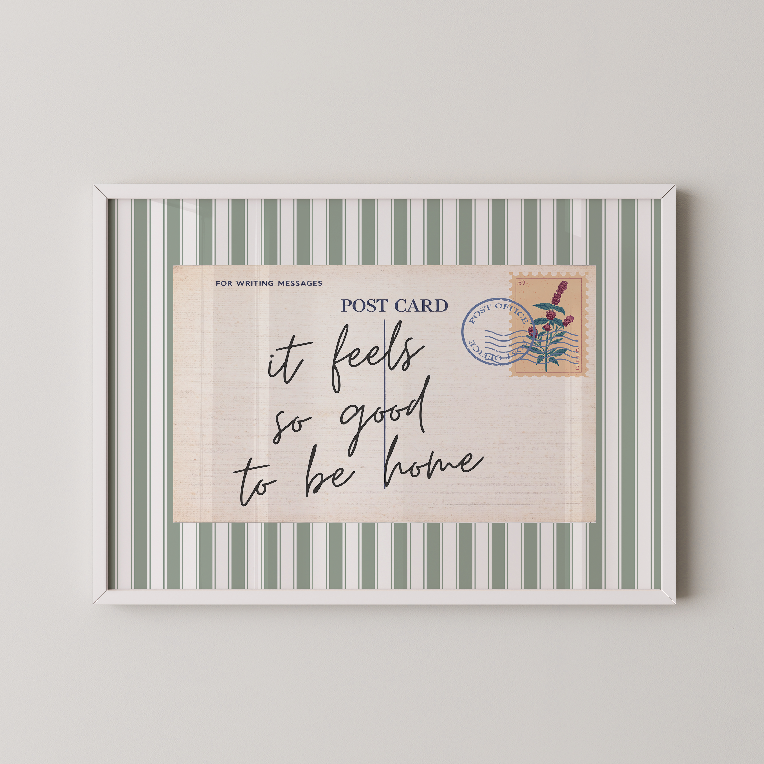 The image is a framed postcard with a handwritten message that reads "it feels so good to be home".