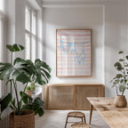 a bright and airy living room with large windows, a wooden cabinet, and a framed artwork featuring a blue and pink striped design hanging on the wall.