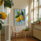 a cozy corner of a room with a wooden chair, a small table with fruit, and a framed painting of lemons hanging on the wall.
