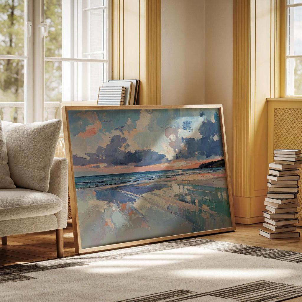 a large painting of a beach scene with a blue sky and clouds, displayed on a wall in a room with a window and a stack of books.