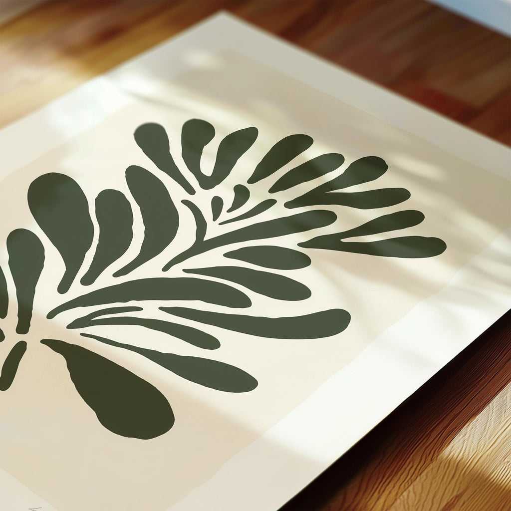 a close-up view of a leaf-like design with dark green outlines on a light background.
