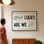 A person is walking past a framed sign that reads "How Lucky Are We" with dice graphics.