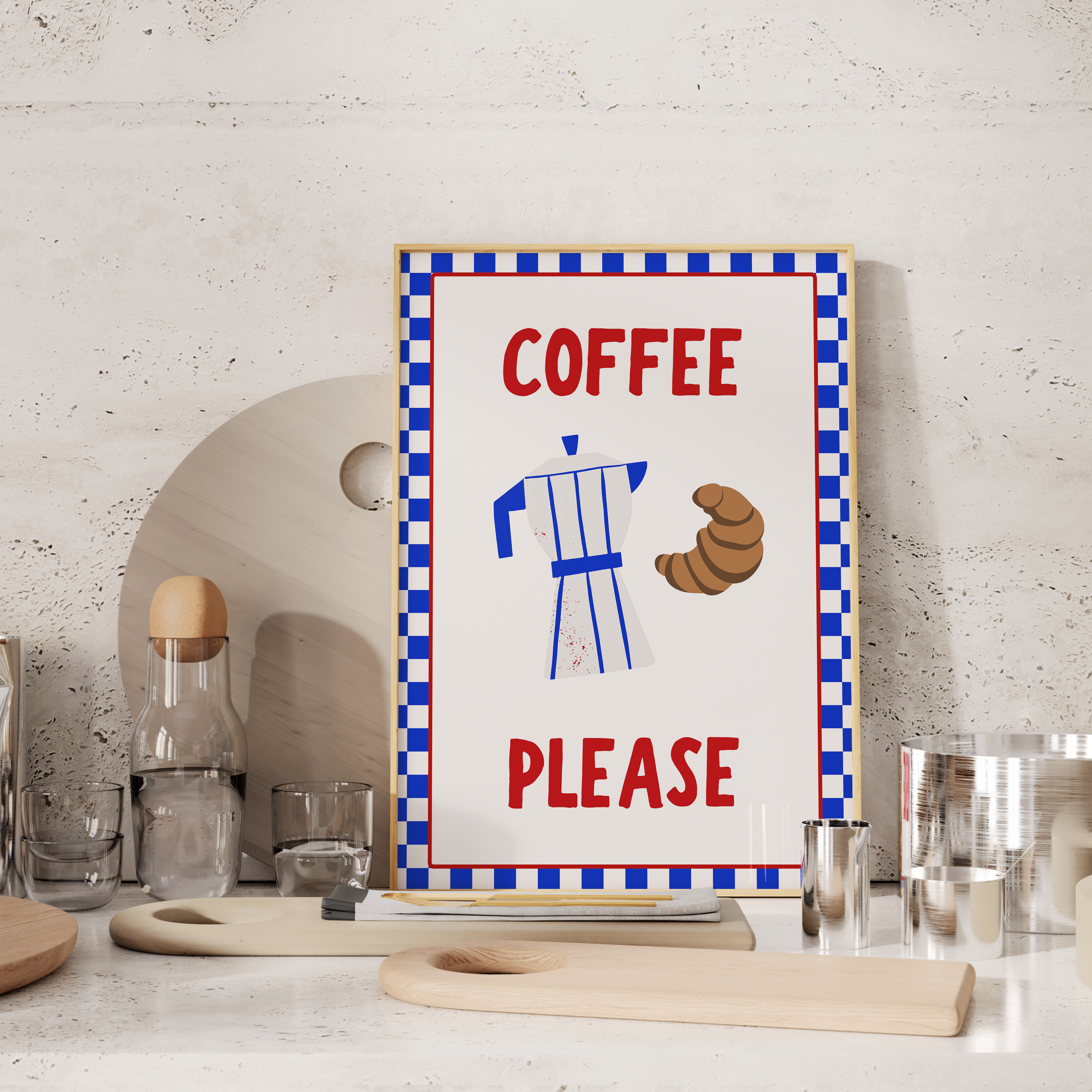 a framed poster with a coffee-themed design, including a coffee maker and a croissant, placed on a kitchen counter.