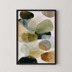 The image is a framed abstract art print featuring a variety of colorful shapes and forms, including circles, ovals, and other organic shapes, arranged in a visually striking composition.
