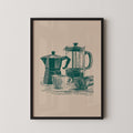 A framed illustration of a coffee maker and two cups on a table.