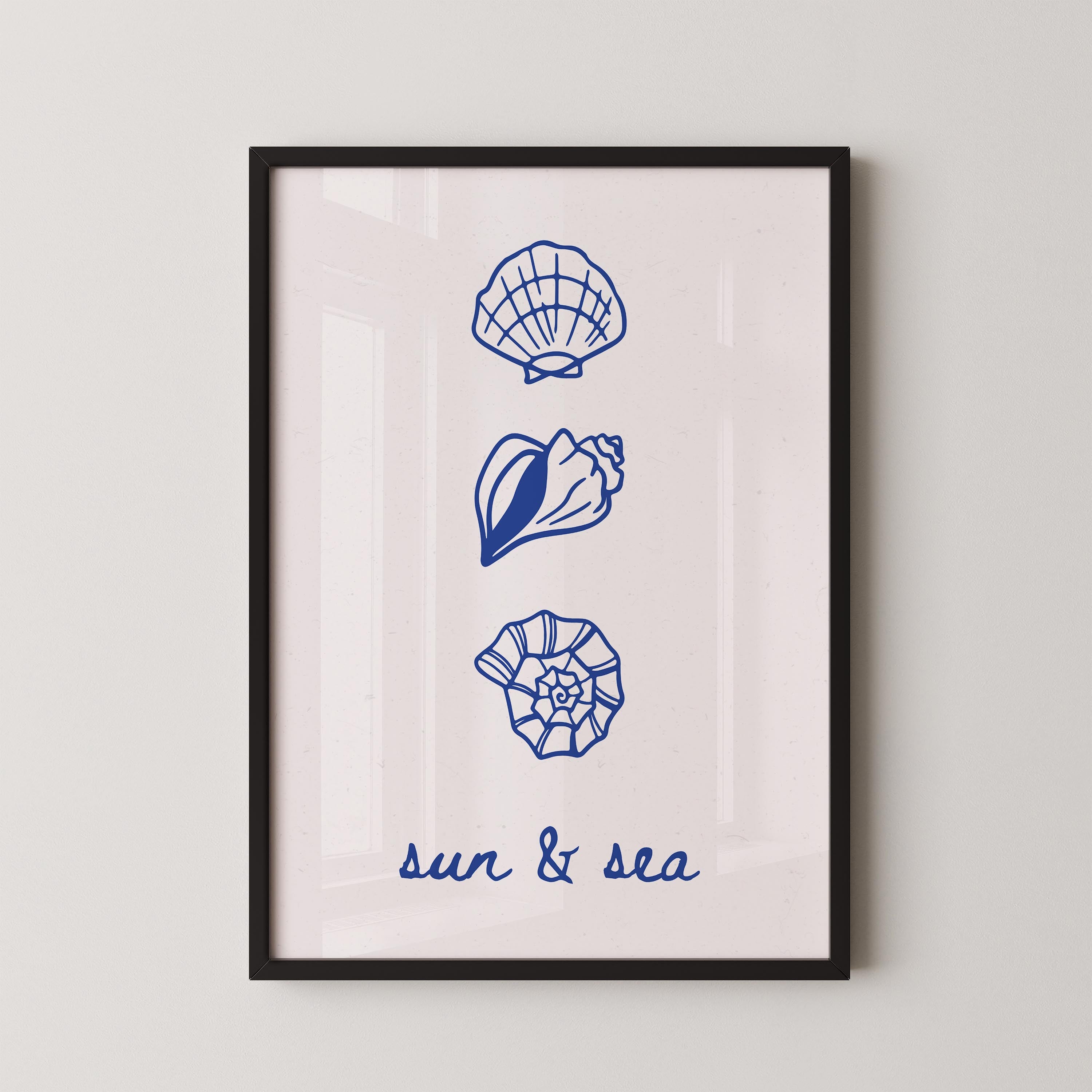The image is a framed print with three blue illustrations of seashells and a text that reads "sun & sea".