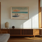 a serene beach scene with a framed painting of a beach chair and umbrella on the wall, complemented by a wooden cabinet and a vase on a shelf below.