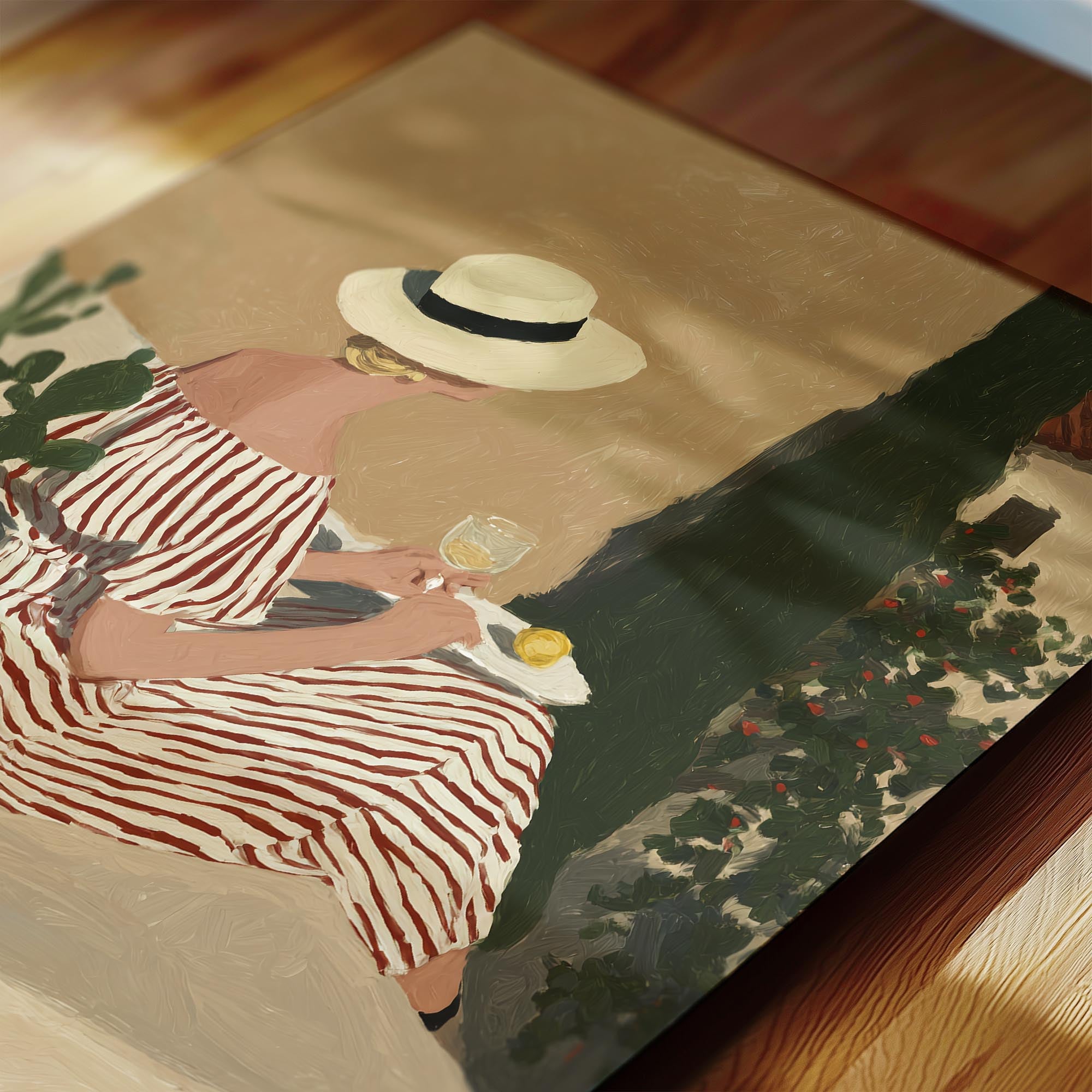 A woman in a striped dress and hat is sitting on a bench, holding a glass of wine and enjoying the outdoors.