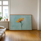 a large painting of a yellow flower on a wooden floor in a room with a window and a radiator.
