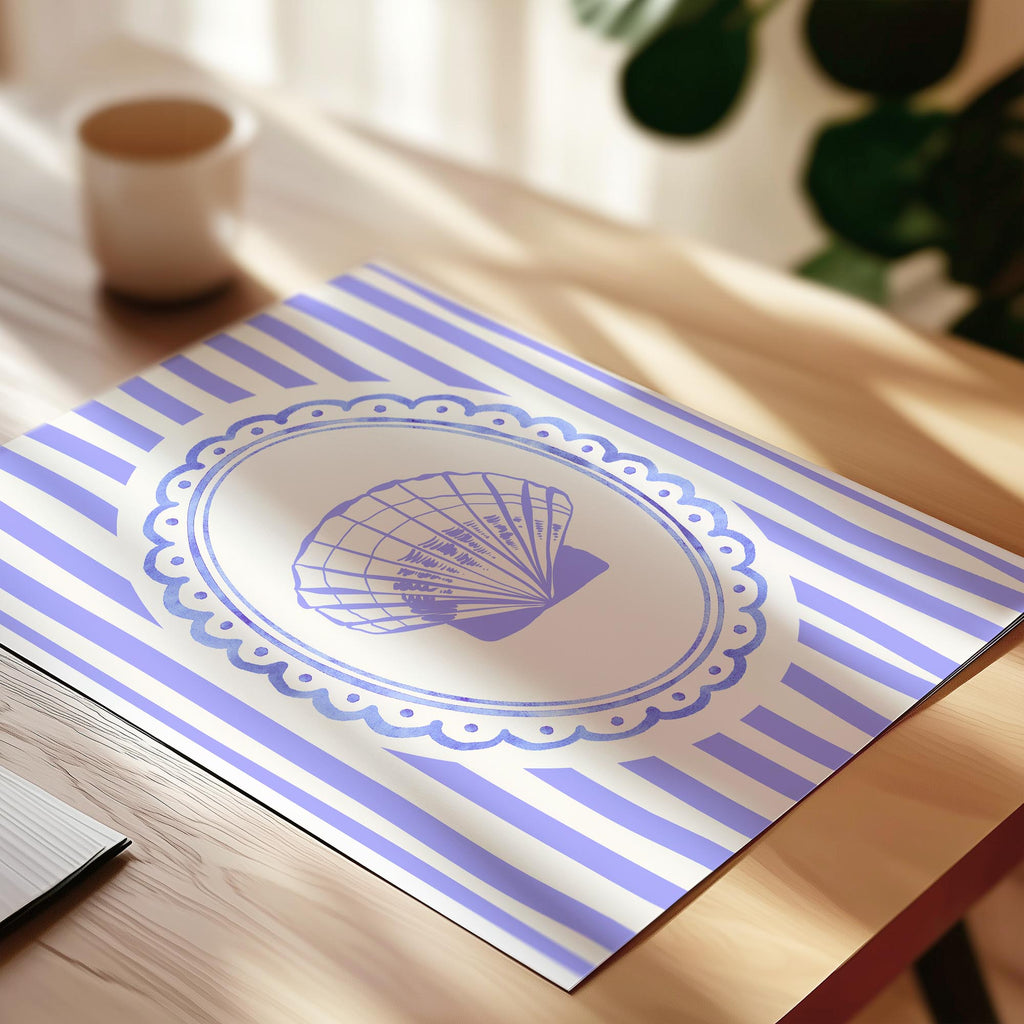 A blue and white striped placemat with a decorative fan design is placed on a wooden table.