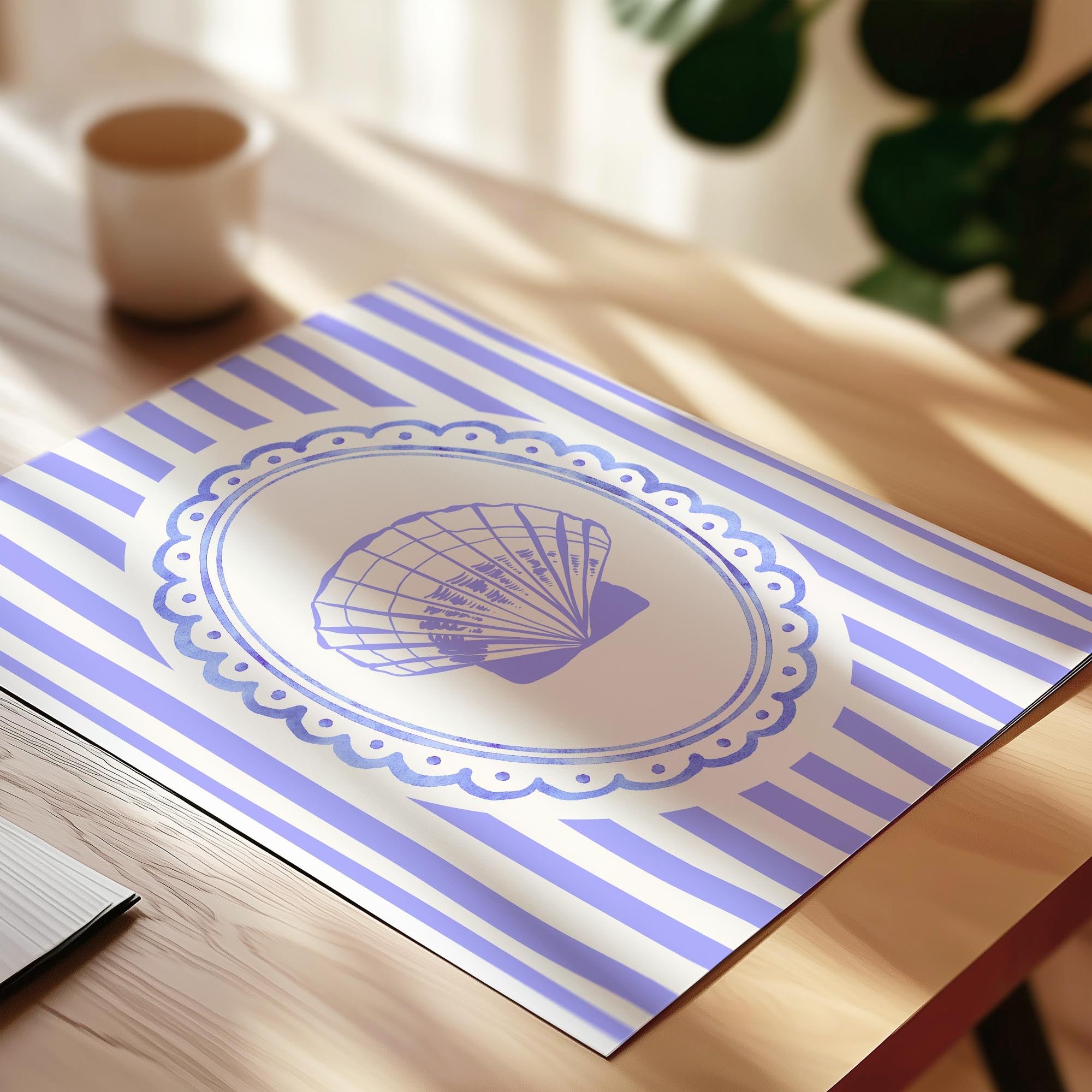 A blue and white striped placemat with a decorative fan design is placed on a wooden table.