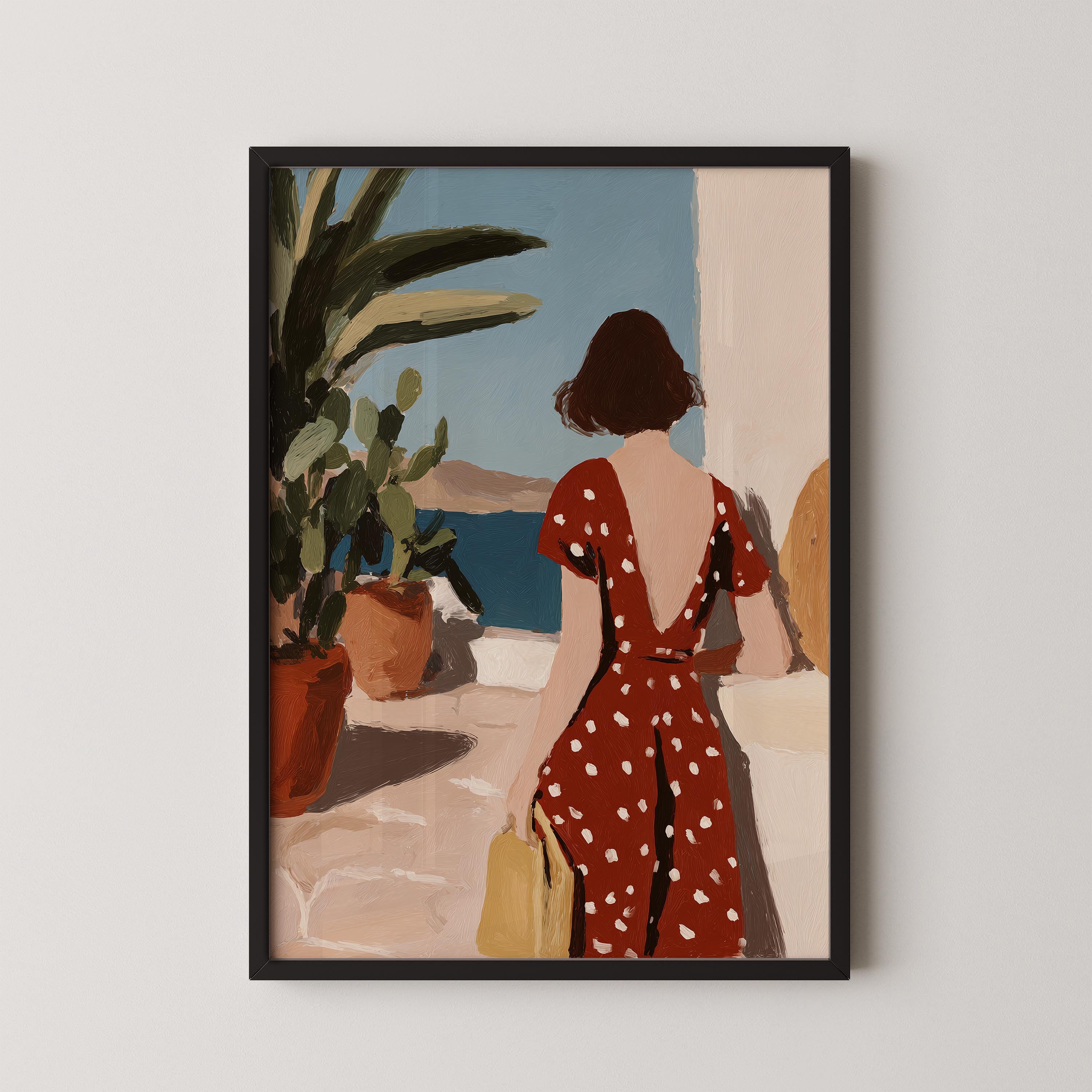 A woman in a red polka dot dress stands in front of a window, overlooking a scenic view of the ocean.
