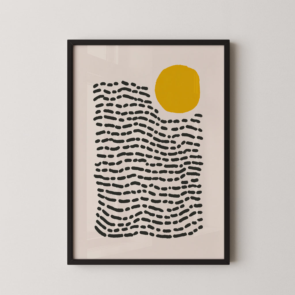 The image is a framed abstract art print featuring a large yellow circle and a pattern of black lines or dots, creating a minimalist and modern design.