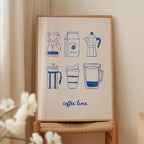 a framed print with illustrations of coffee-making equipment, including a French press, a coffee bag, a coffee pot, a coffee cup, and a coffee mug. The text "coffee time" is written below the illustrations.