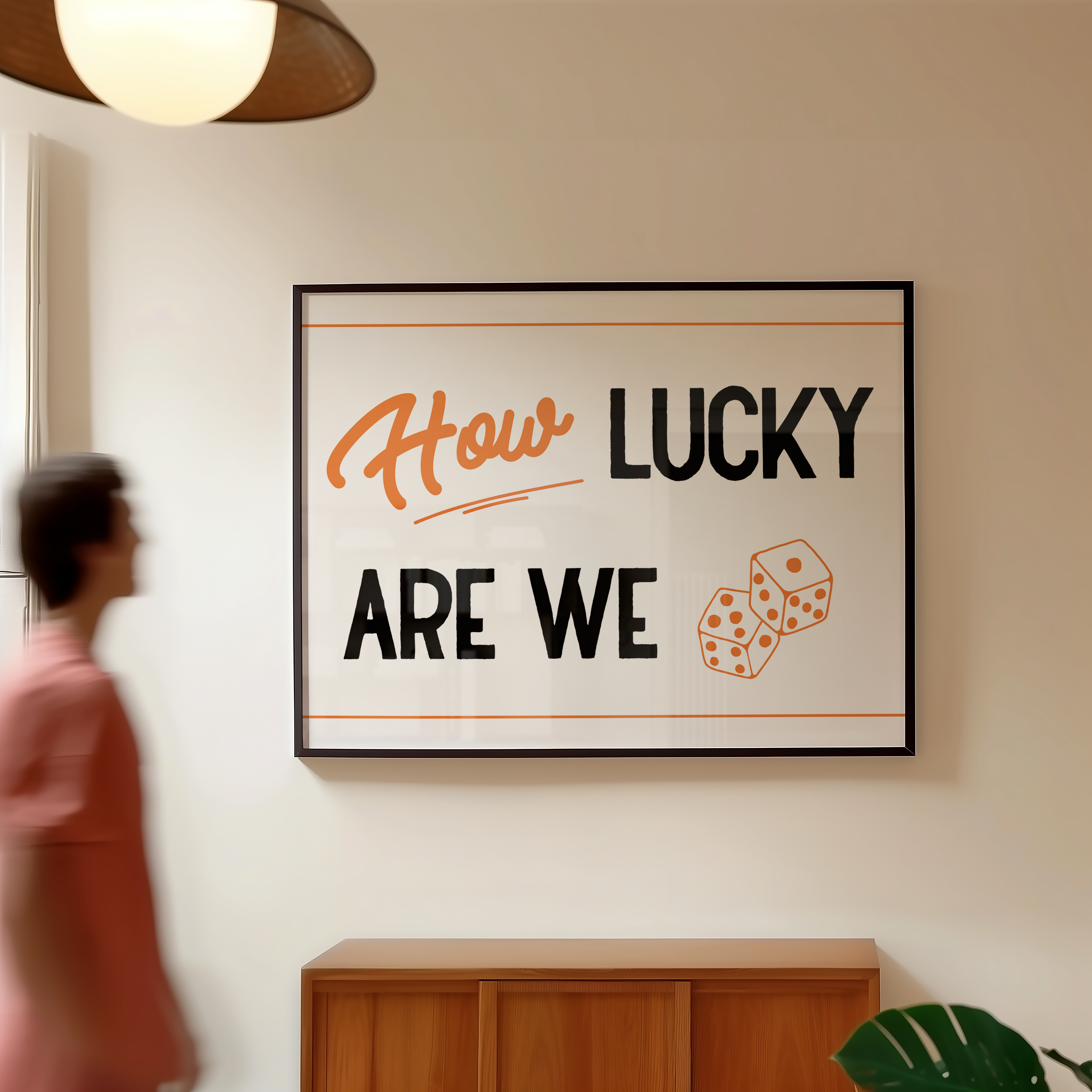 a person walking past a framed sign that reads "How Lucky Are We".