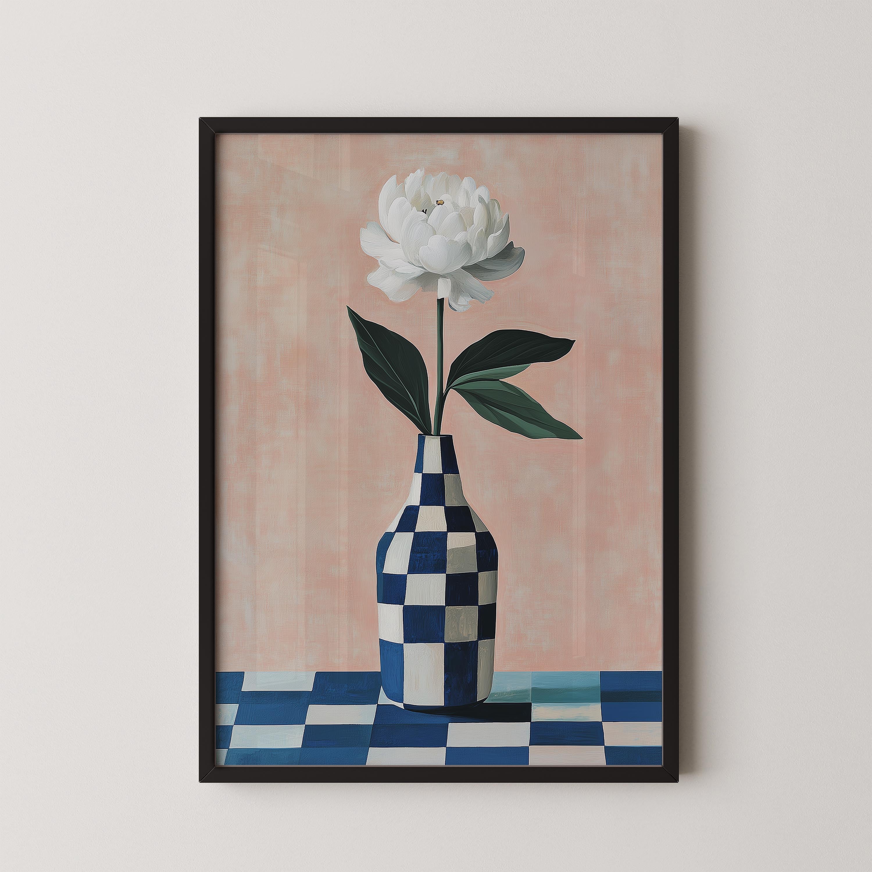 A framed painting depicting a white flower in a blue and white checkered vase, placed on a checkered tablecloth.