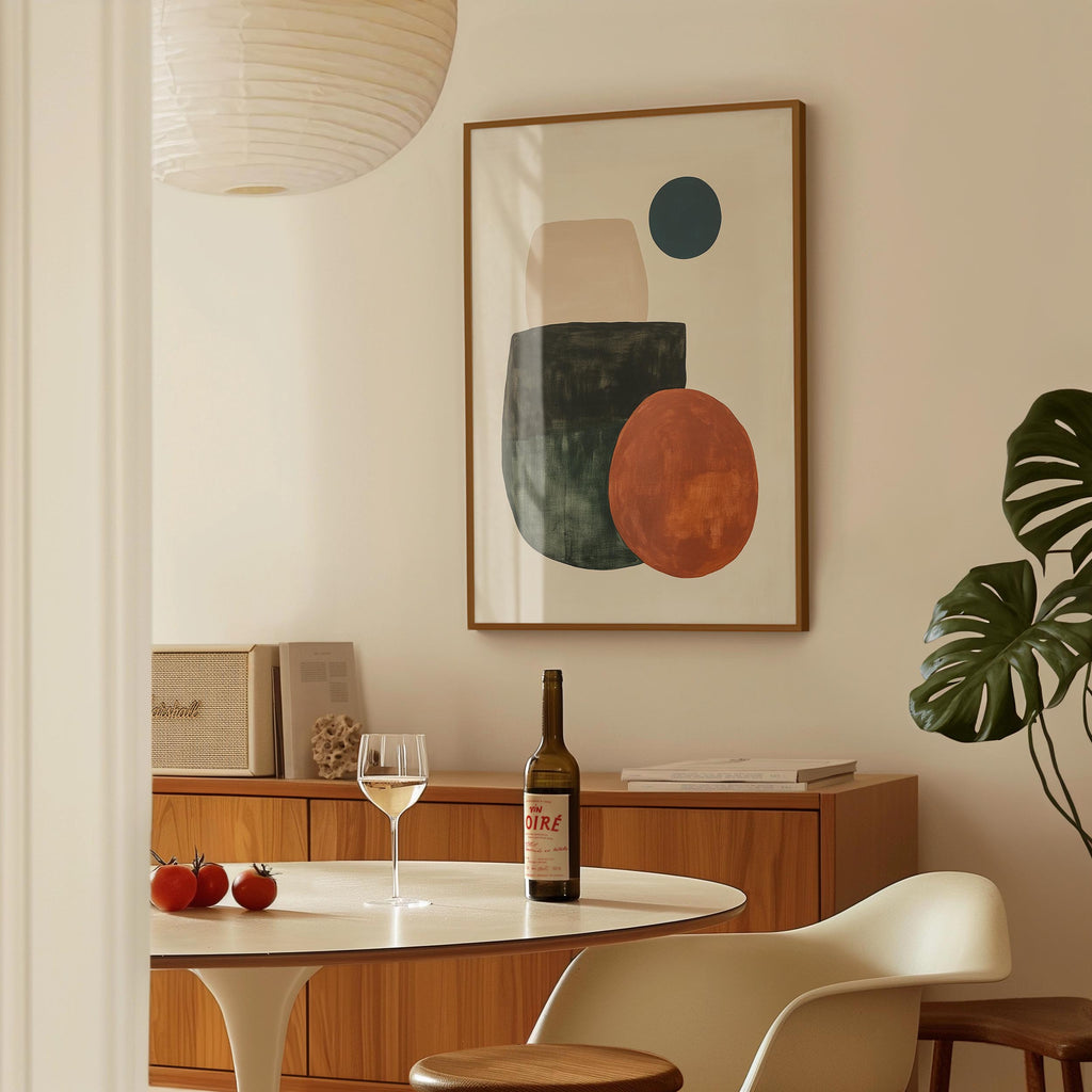 a dining room with a table set for two, a bottle of wine, and a framed abstract painting on the wall.