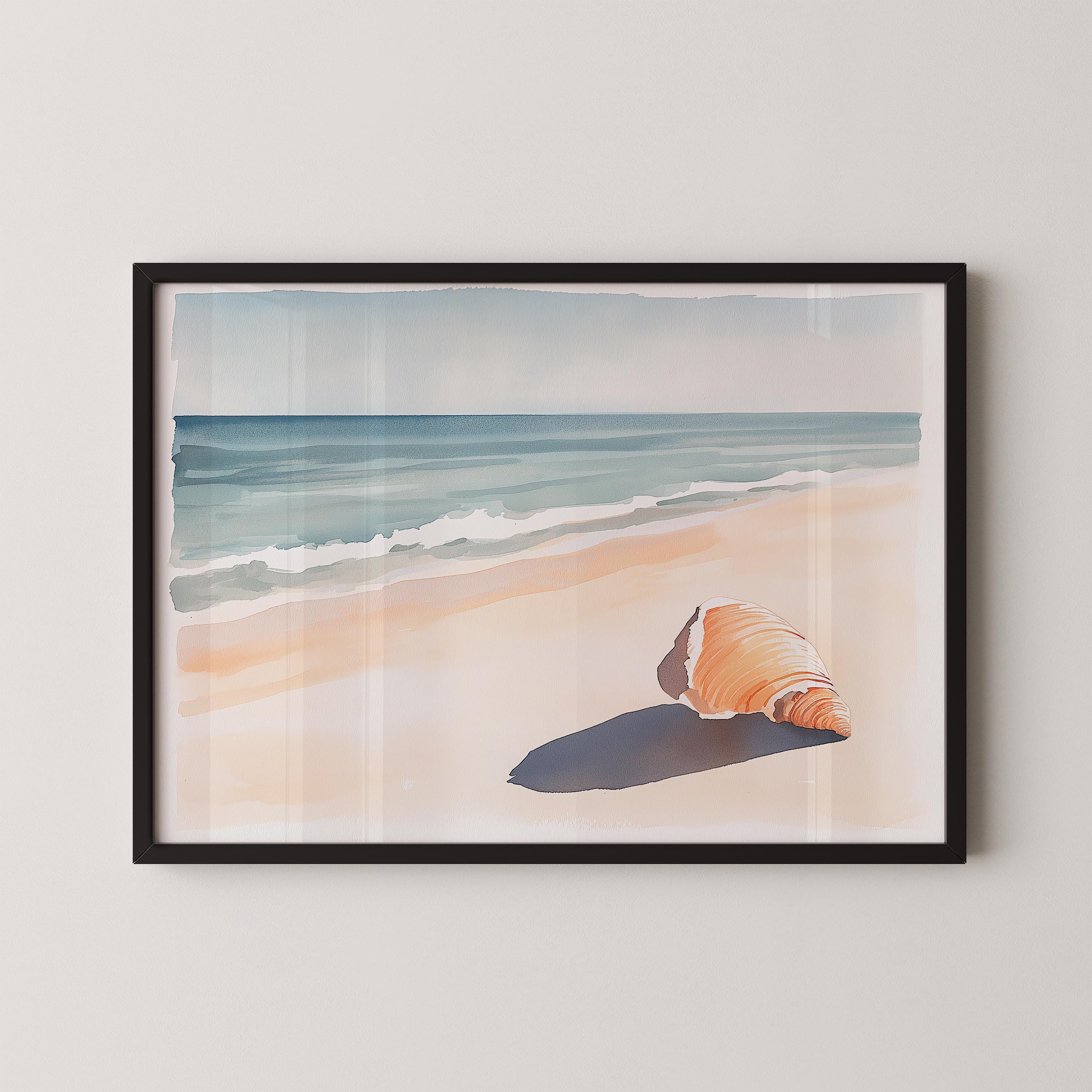 A framed watercolor painting depicting a seashell resting on a sandy beach, with the ocean visible in the background.
