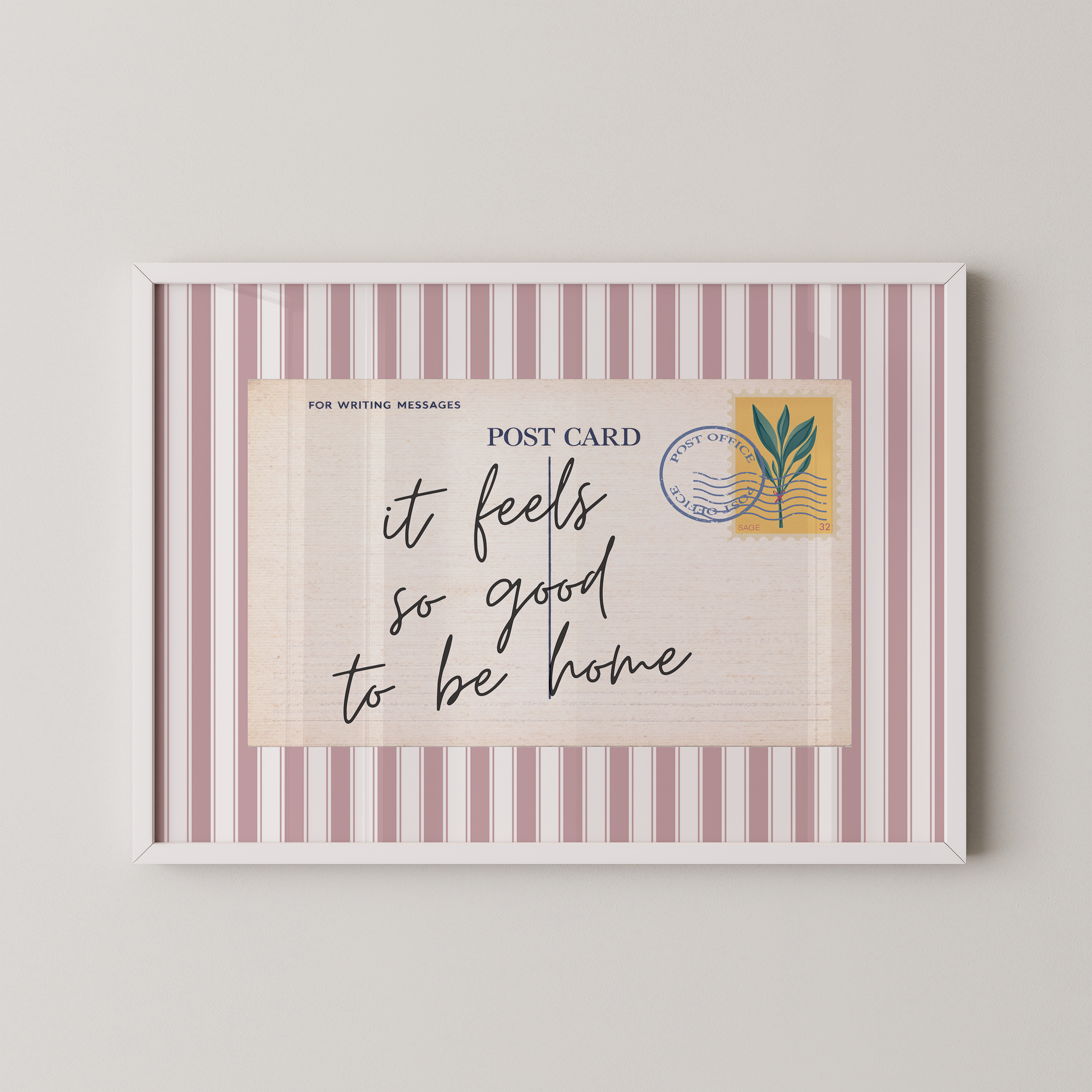 The image is a framed postcard with a handwritten message that reads "it feels so good to be home".