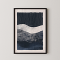 The image is a framed abstract art print featuring a dark blue and white color scheme with horizontal lines and curves.
