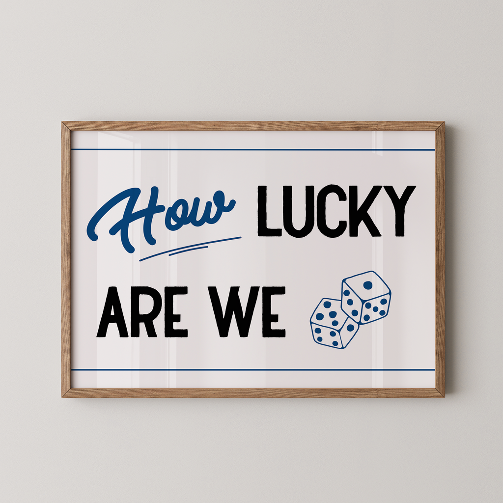 a framed poster with the text "How LUCKY ARE WE" and two dice graphics.