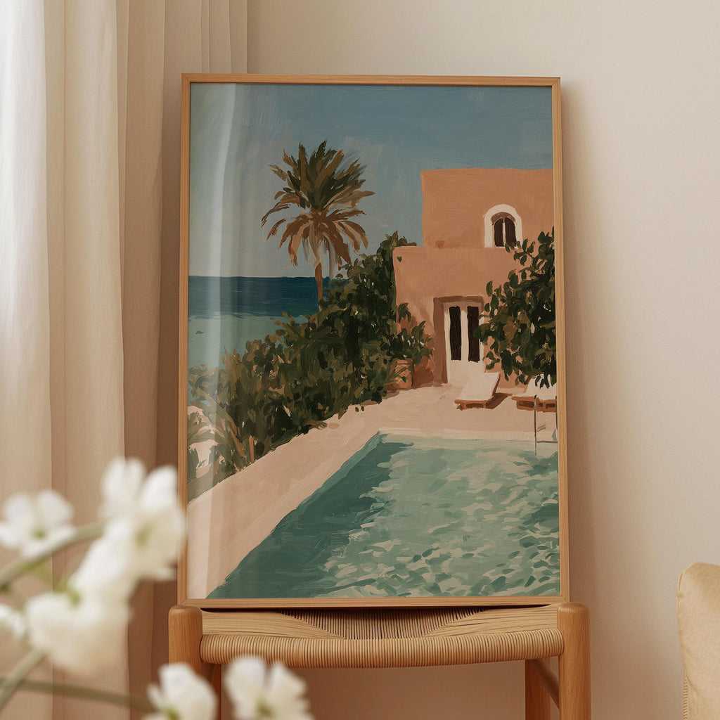 a painting of a house with a pool and palm trees, displayed on a wooden frame.