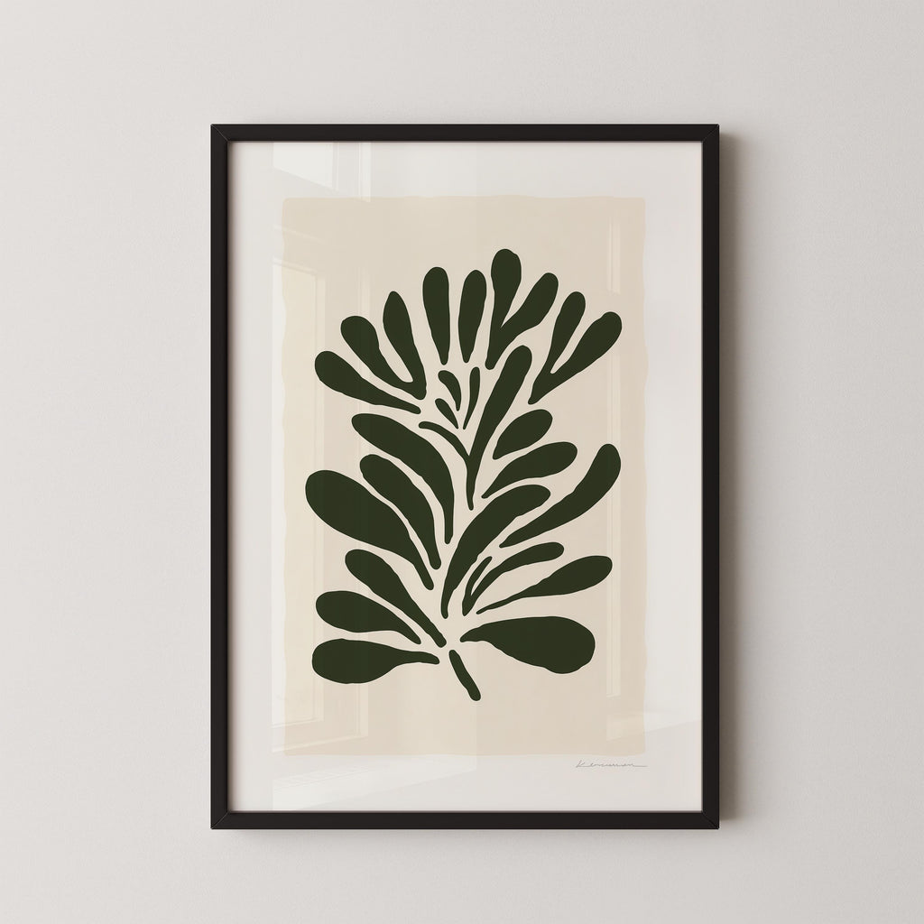 a framed artwork of a stylized plant or leaf design in a black frame.