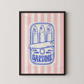 a framed illustration of a can of sardine with the word "Sardine" written on it.