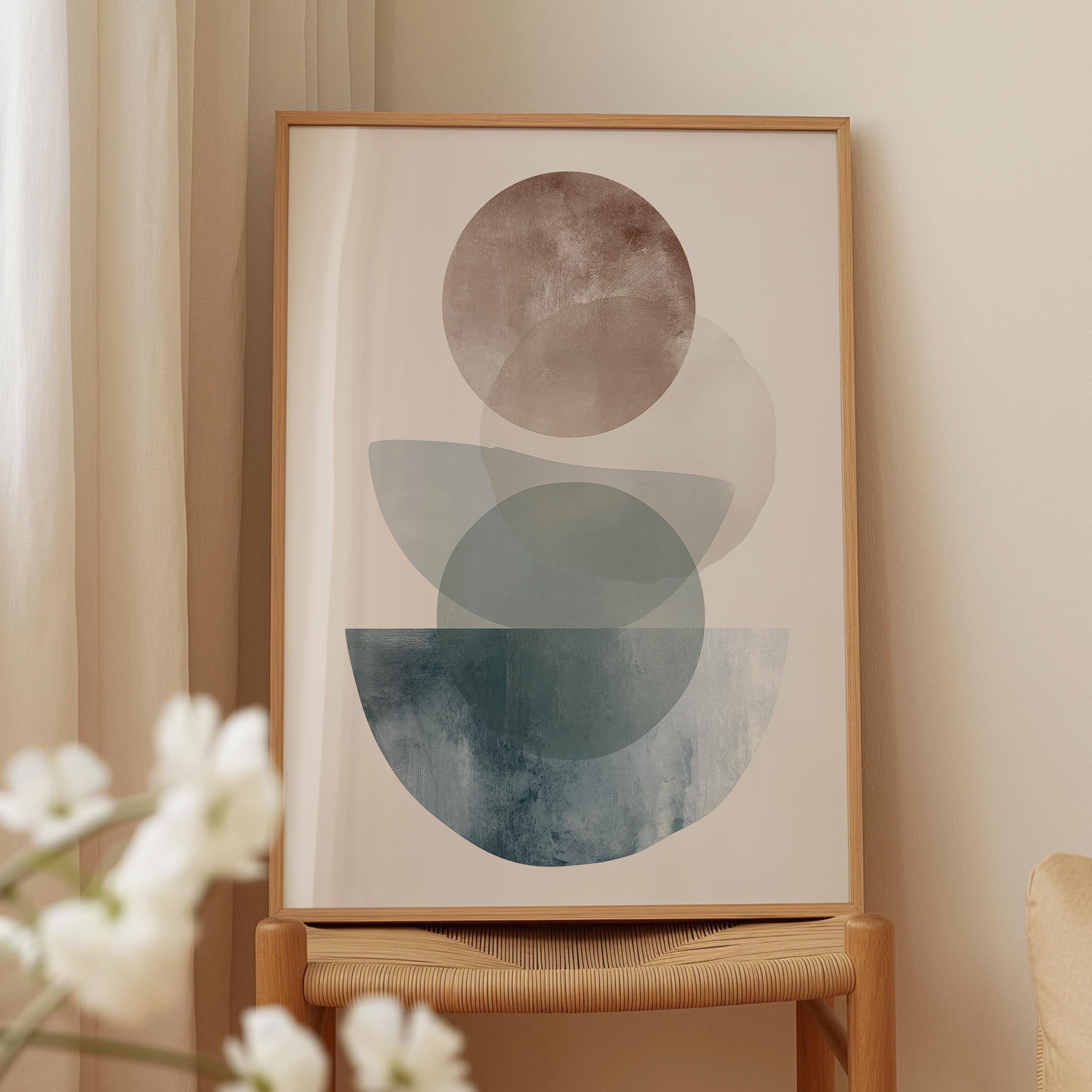 a framed abstract art print displayed on a wooden stand.