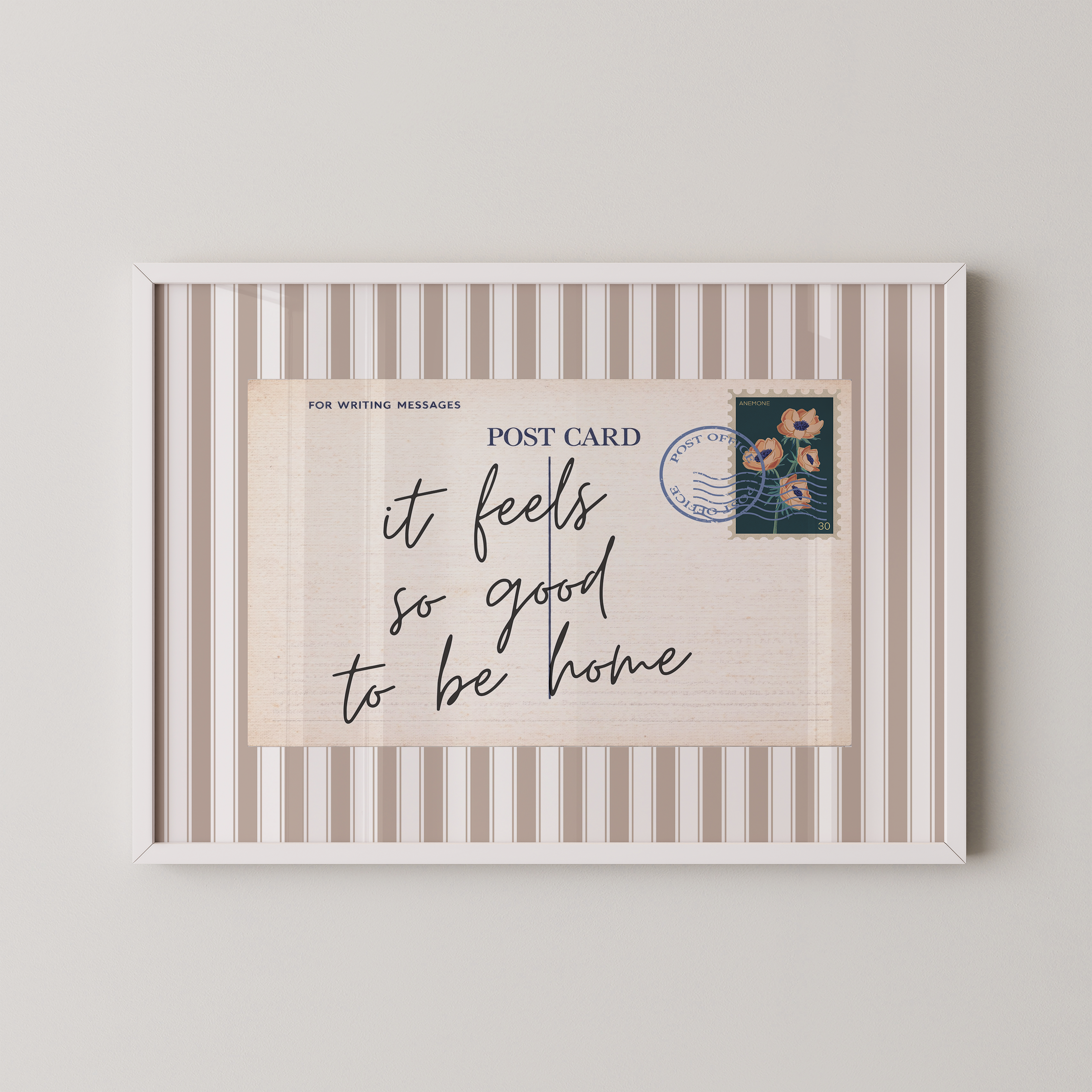 The image is a framed postcard with a handwritten message that reads "it feels so good to be home".