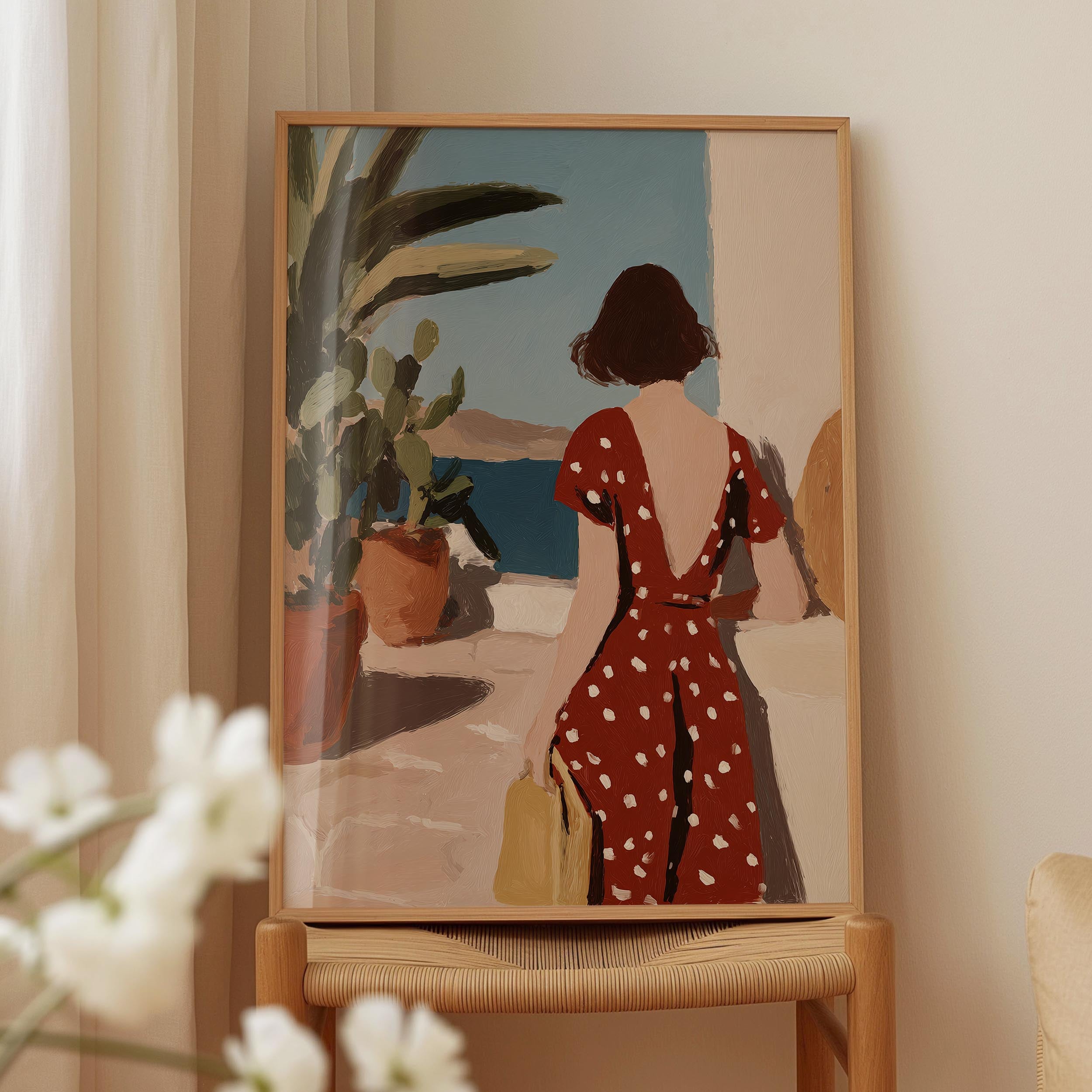a woman in a red polka dot dress standing in front of a window, looking out at the ocean.