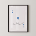 The image is a framed print with a white background and a black border. It features a blue heart symbol and the text "How lucky are we?" written in a cursive font.
