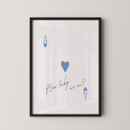 The image is a framed print with a white background and a black border. It features a blue heart symbol and the text "How lucky are we?" written in a cursive font.