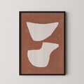 The image is a framed abstract art piece with a brown background and two white shapes, one larger and one smaller, creating a minimalist and modern design.