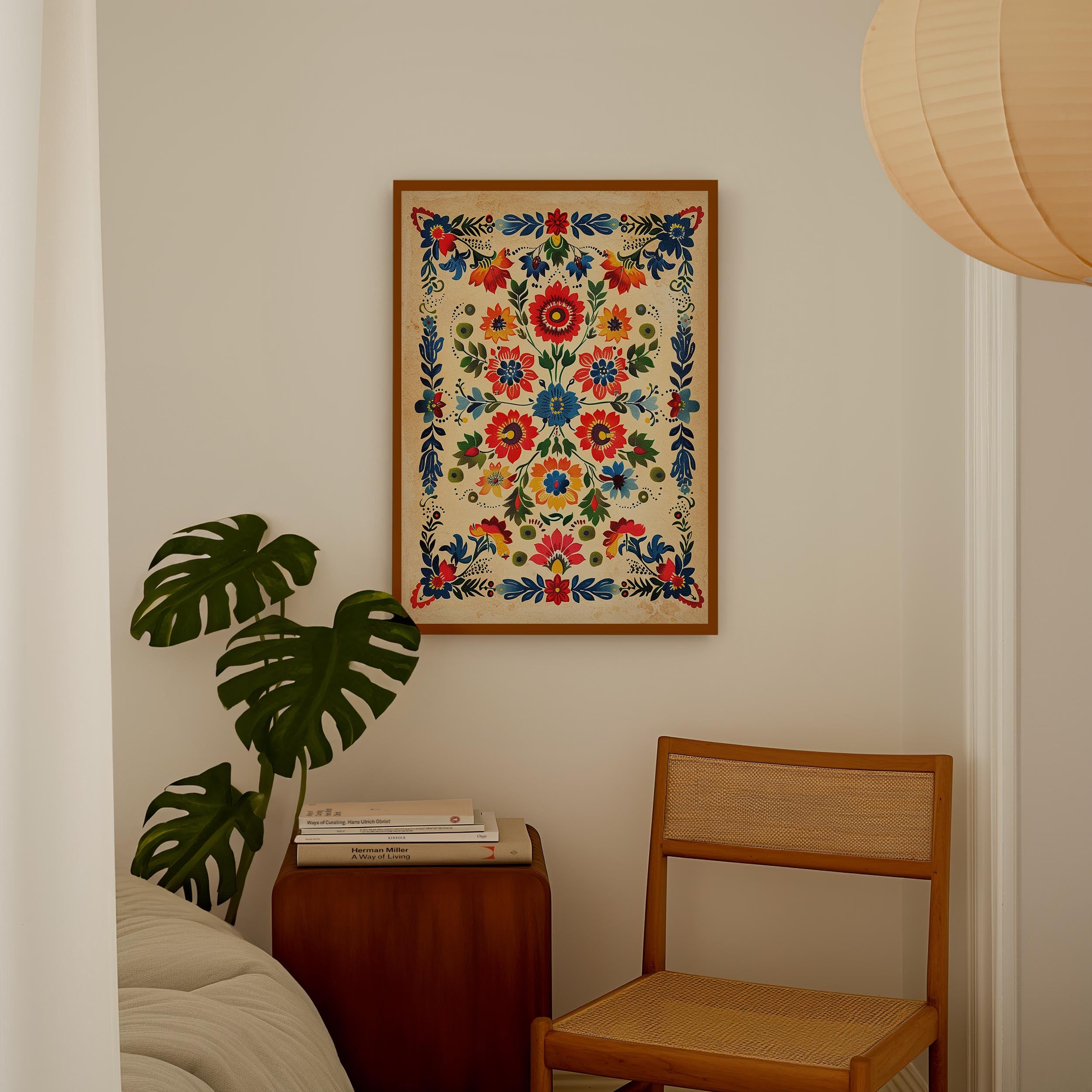 a cozy corner of a room with a wooden chair, a wooden side table, and a framed floral print hanging on the wall.