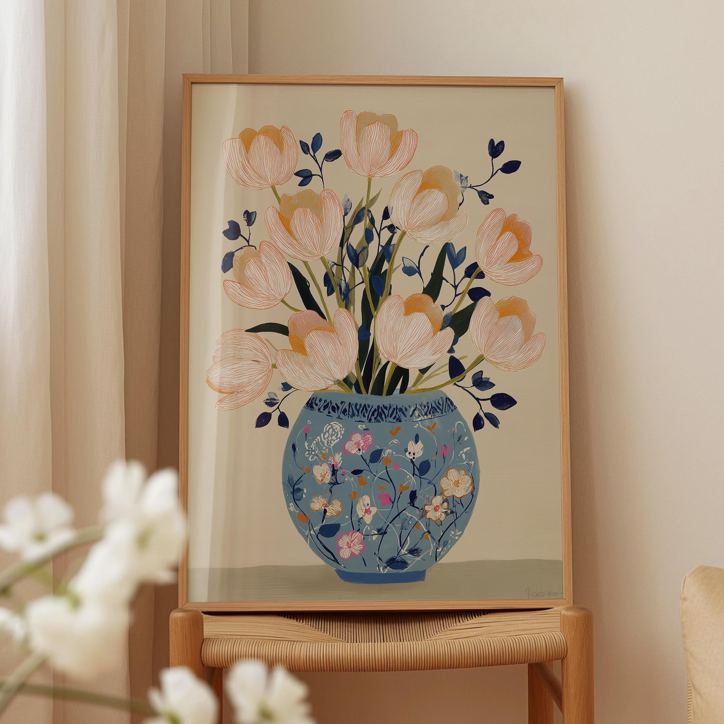 A framed painting of a vase filled with pink flowers is displayed on a wooden shelf.
