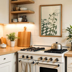 a cozy kitchen scene with a white gas range, wooden cutting board, and various kitchen accessories such as a coffee maker and a plant.