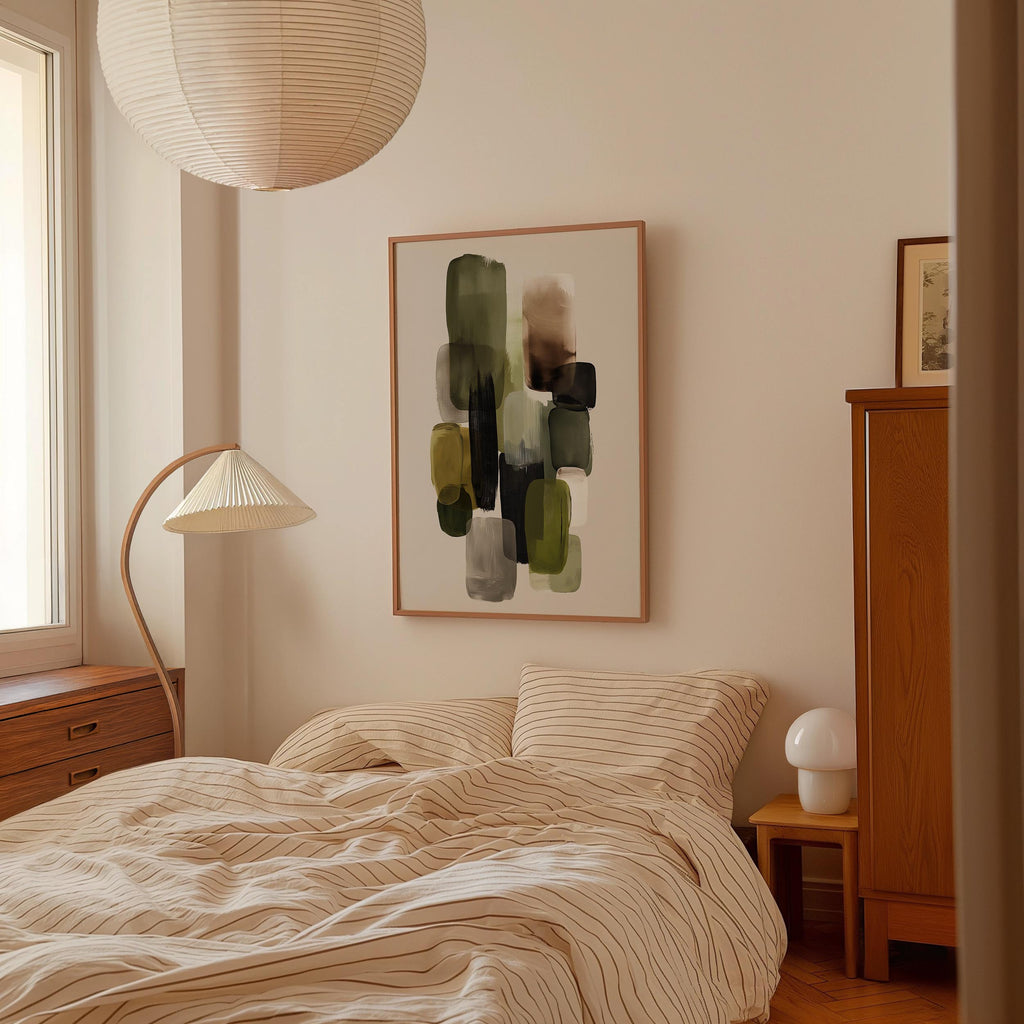 a cozy bedroom with a large bed, a wooden dresser, and a lamp. The room has a minimalist and modern design, with a large abstract painting hanging on the wall above the bed.