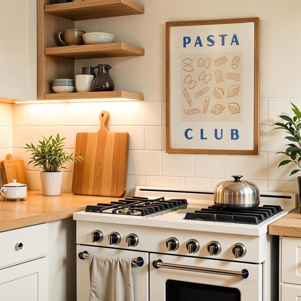A modern kitchen with a white stove, wooden cutting board, and a framed poster on the wall that says "PASTA CLUB".