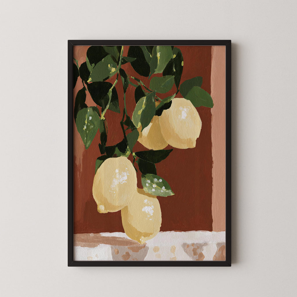 A framed painting depicting a bunch of lemons hanging from a branch with green leaves.