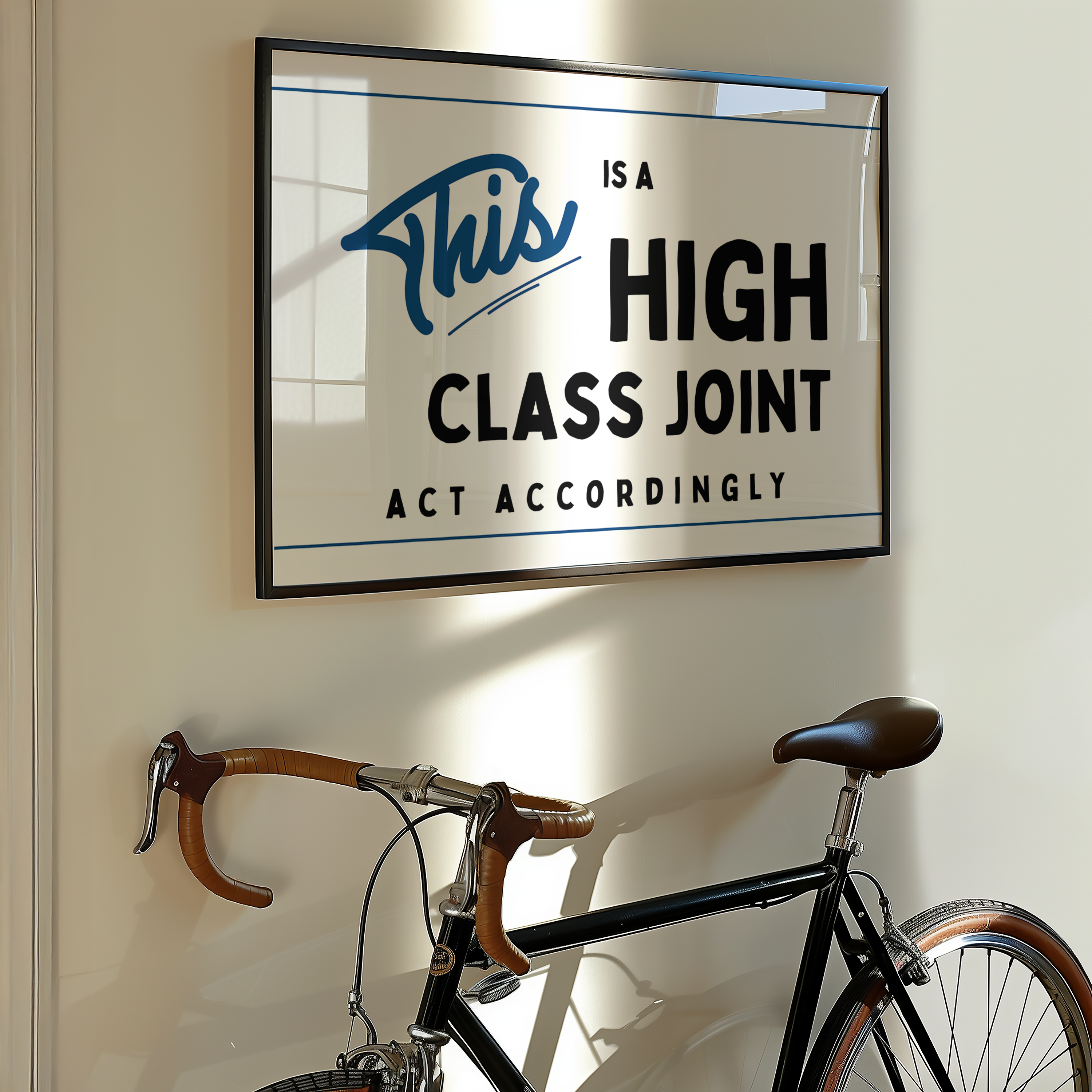 a framed sign with the text "This is a HIGH CLASS JOINT ACT ACCORDINGLY" hanging on a wall above a bicycle.