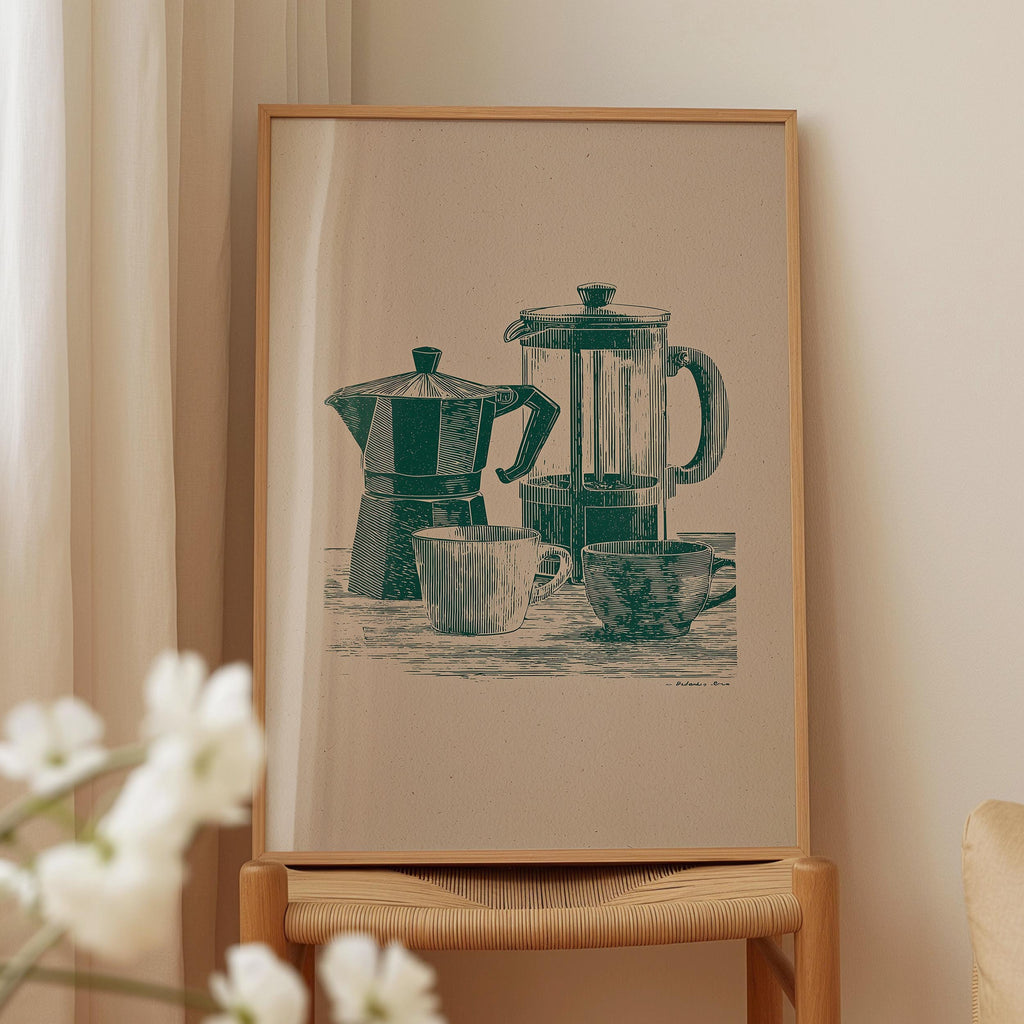 a framed illustration of a coffee maker, a teapot, and two cups on a table.