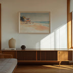 a serene beach scene with a lifeguard tower, a vase, and a book on a wooden cabinet.