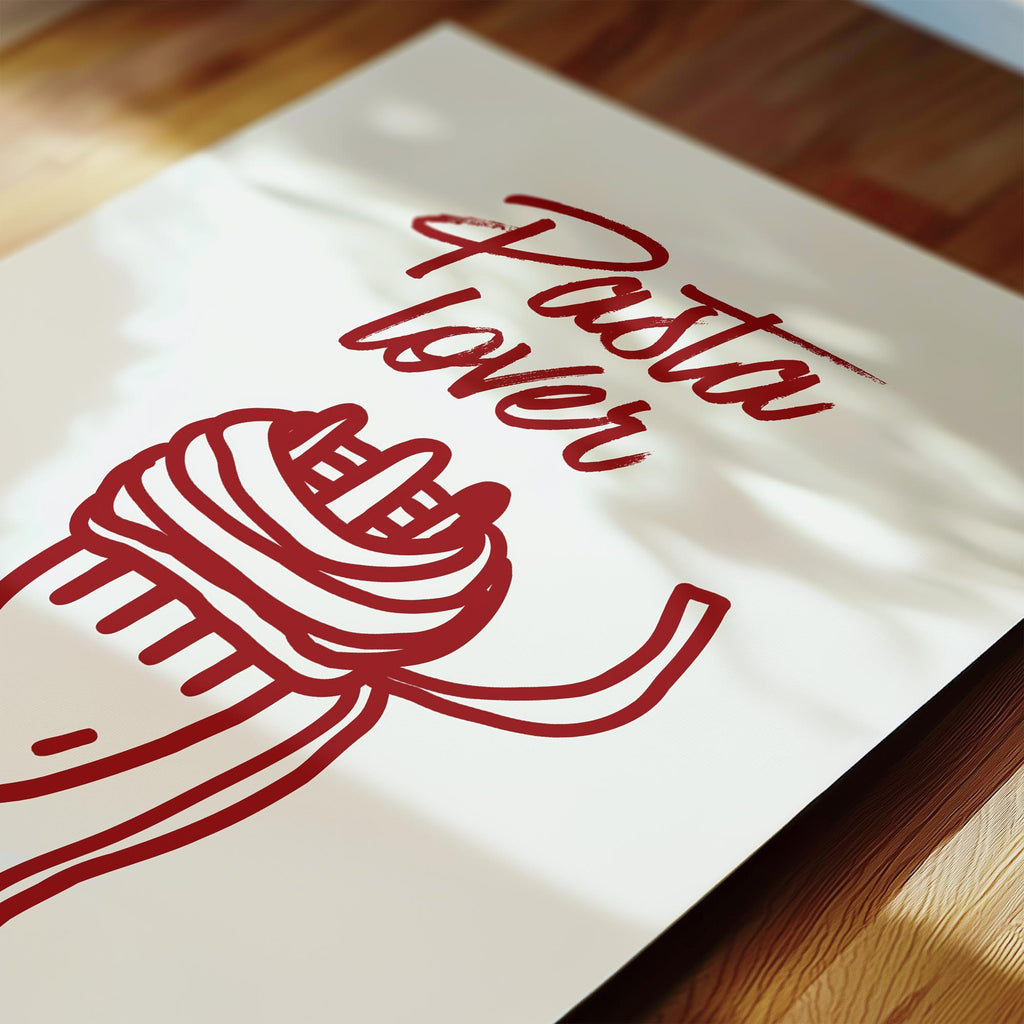 a close-up view of a white paper with a red drawing of a pasta dish and the text "Pasta Lover" written above it.