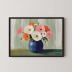 A framed painting depicting a vase filled with colorful flowers, including white, pink, and orange blooms, set against a green background.
