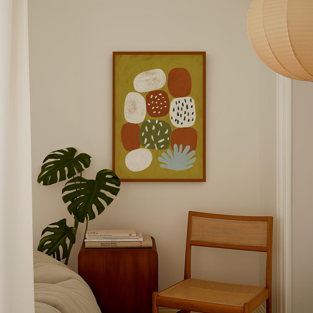 a cozy corner of a room with a wooden chair, a wooden side table, and a framed abstract painting hanging on the wall.